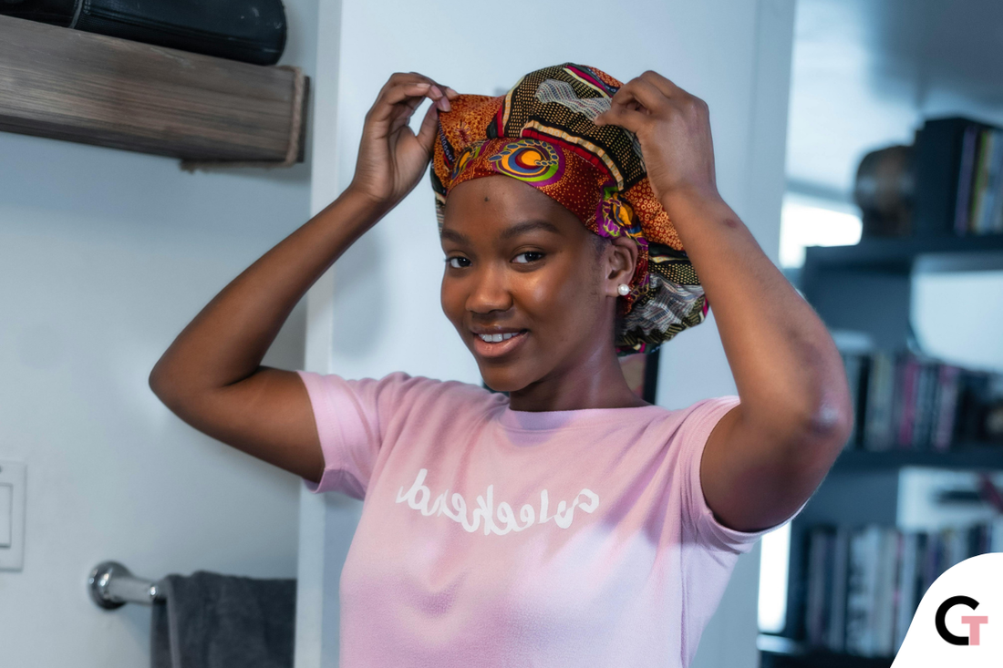 Trying on a hair bonnet for 4C hair