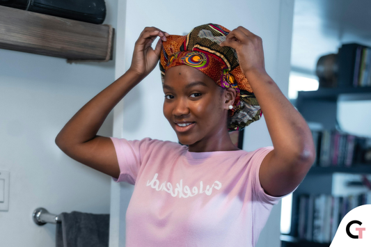 Trying on a hair bonnet for 4C hair